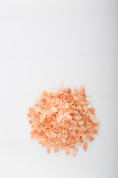 Himalayan rock salt in white bowl over grey background - Photo, Image