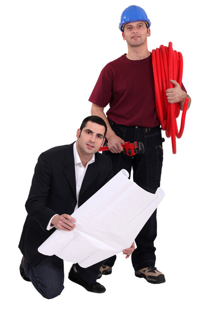 Tradesman and engineer standing side by side - Foto, Imagen