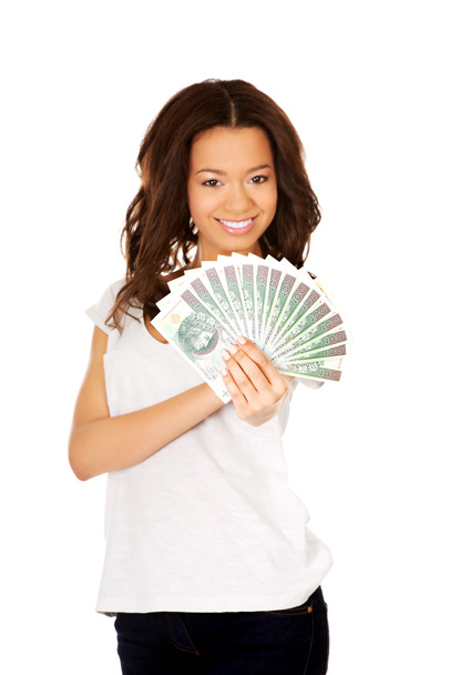 African woman holding polish money. - Foto, imagen