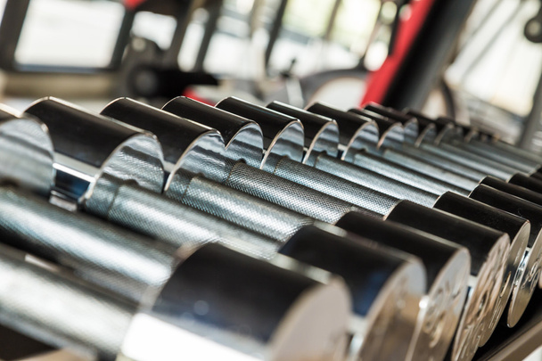 Dumbbells weight training equipment in gym close up - Photo, Image