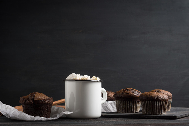 Cup of hot cocoa with marshmallows and chocolate muffins - Photo, Image