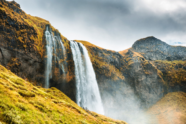 Beautiful and famous Seljalandsfoss waterfall, South Iceland. - Fotoğraf, Görsel