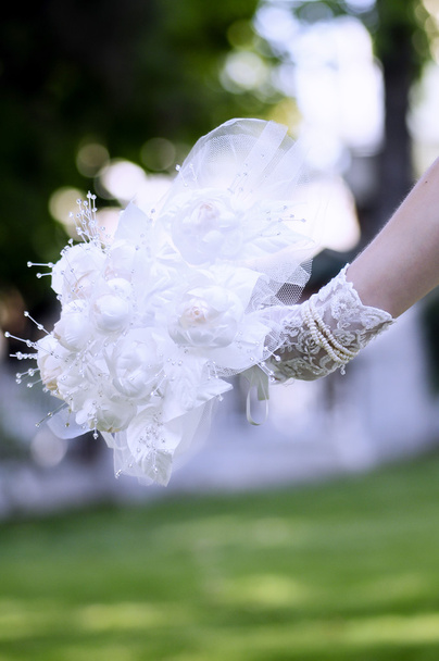 Bride hold lace rose bouquet her hand - Photo, Image