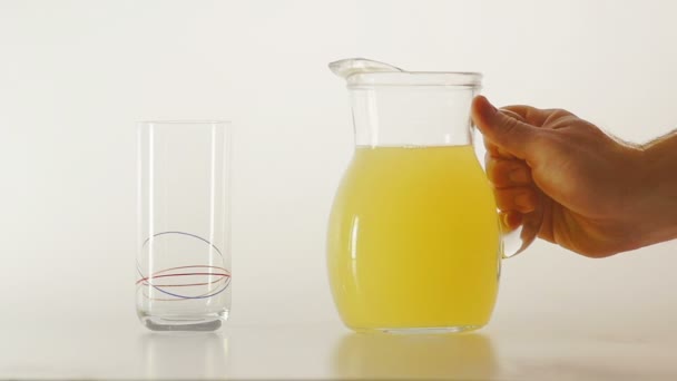 pouring glass with fruit juice - Felvétel, videó
