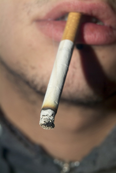 Cigarette between his lips - Фото, зображення