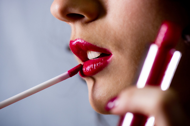 Beautiful female red gloss lips with brash - Foto, imagen