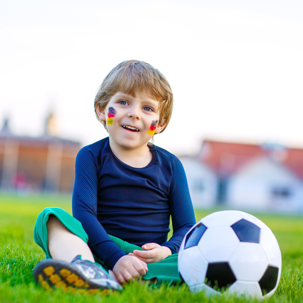Kid boy playing soccer with football  - Zdjęcie, obraz