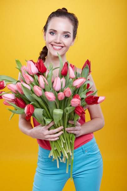 woman with tulips flowers - 写真・画像