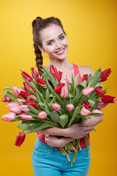 woman with tulips flowers - Photo, image