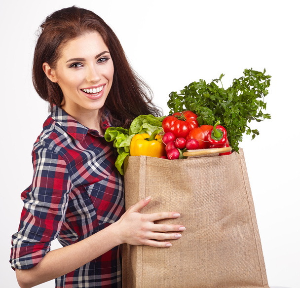 woman with grocery bag and vegetables - Foto, Imagen