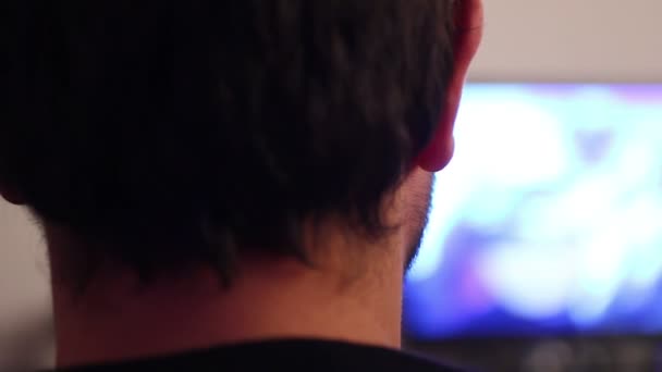 Back of man watching tv - Footage, Video