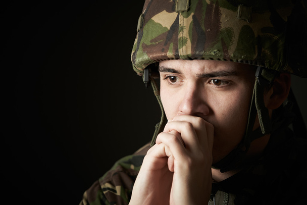 Soldier In Uniform Suffering From Stress - Foto, afbeelding