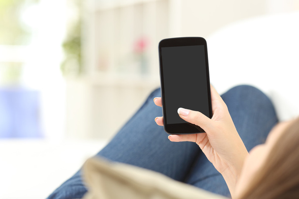 Girl using and showing a blank phone screen - Φωτογραφία, εικόνα