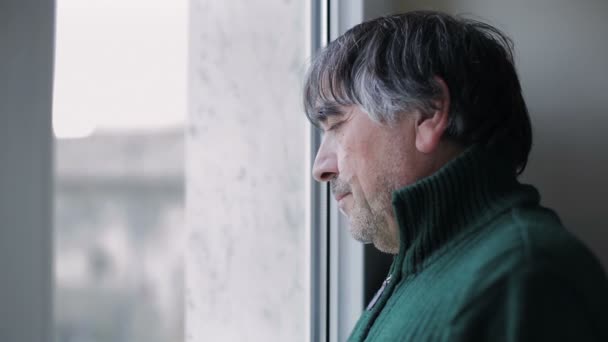 pensive man at the window - Felvétel, videó