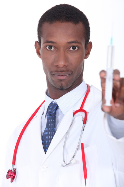 Man with syringe in hand - Фото, изображение