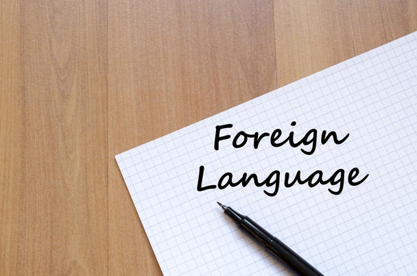 Foreign language write on notebook - Фото, зображення