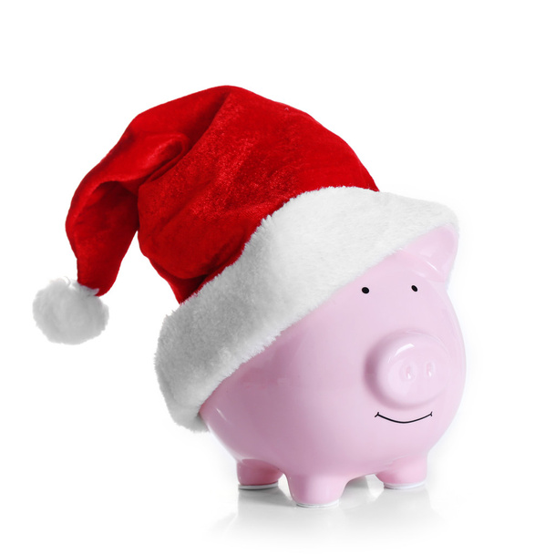 Piggy bank with Santa hat  - Foto, Bild