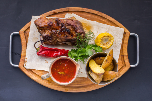 Roasted pork loin with corn and chili pepper - Фото, зображення