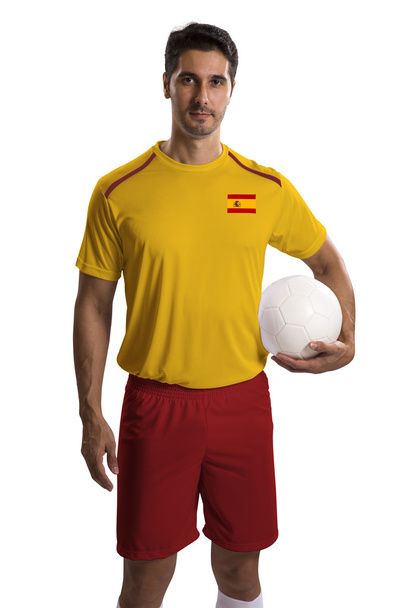 Spanish soccer player holding ball on white background - Fotografie, Obrázek