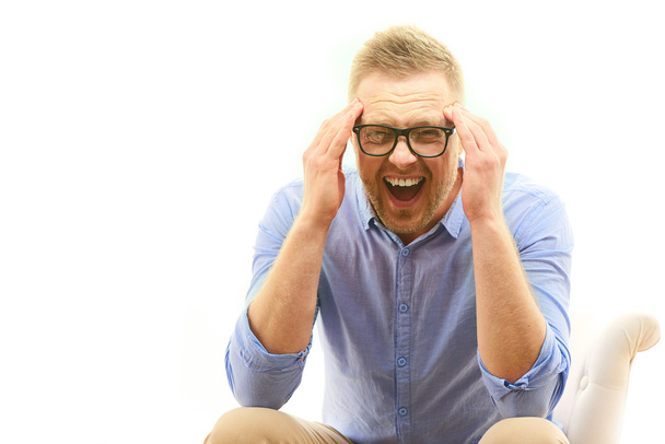 Man having a heavy headache or he is very stressed - Фото, изображение