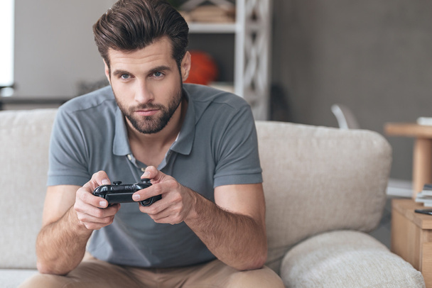 young man playing video game - 写真・画像