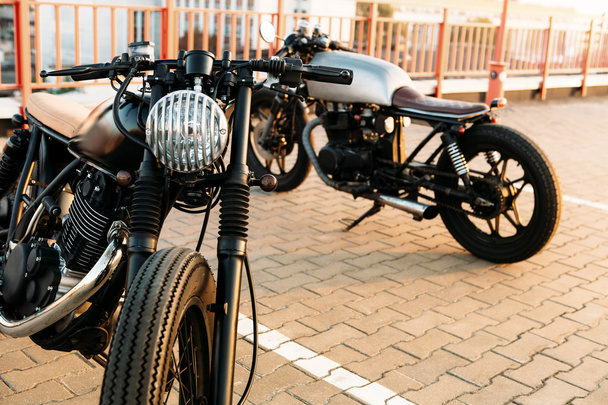 Two black and silver vintage custom motorcycles caferacers - Foto, Imagem