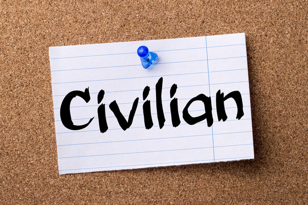 Civilian - teared note paper pinned on bulletin board - Photo, Image