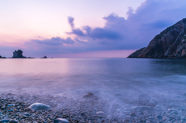 Long exposure of a beautiful sunset over the sea - Photo, Image