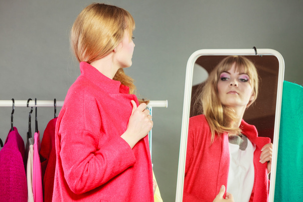 Pretty girl looking into mirror. - Fotografie, Obrázek