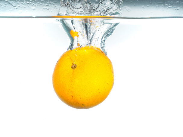 drop orange  in the water - Foto, immagini