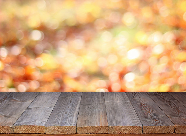 Empty wooden table on an blurred background. - Foto, imagen