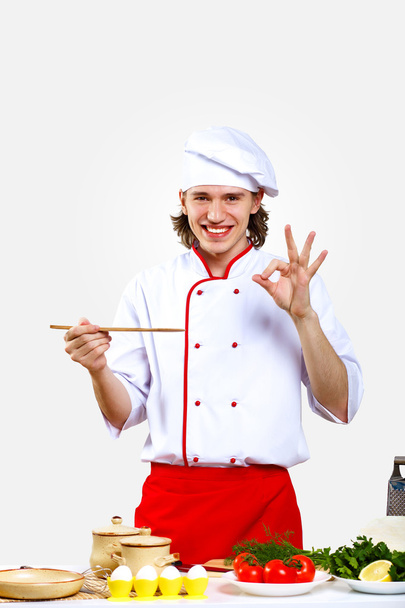 Portrait of a young cook in uniform - 写真・画像