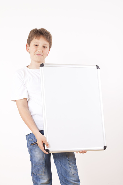 Boy holding white drawing board - Photo, Image