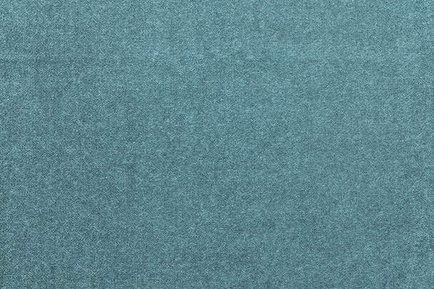 speckled textured monochrome background from fabric of pale turquoise color - Photo, Image