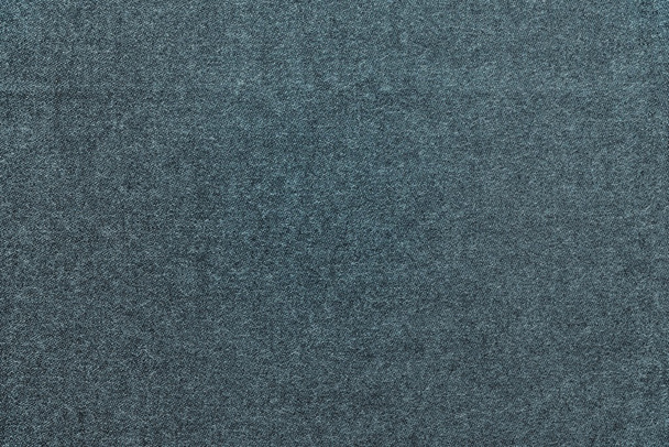 speckled textured monochrome background from fabric of dark turquoise color - Photo, Image