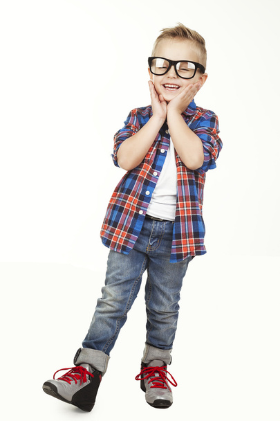 Funny child.fashionable little boy in glasses, jeans, white t-shirt and plaid shirt.stylish kid  in shock and surprise. fashion children - Photo, Image