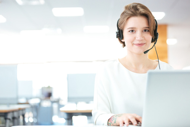Smiling woman customer support call operator in office - Photo, Image