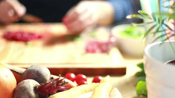 man hands cutting raspberries - Video, Çekim