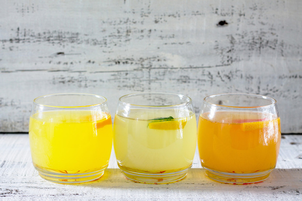 Fresh citrus juices (orange, grapefruit and lemon) - Photo, Image