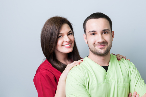 Dentist team or couple on gray copy space - Valokuva, kuva