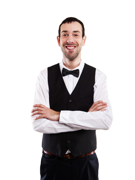 Σερβιτόρος, κρατώντας την κασέτα με χαμόγελο, απομονωθεί σε λευκό φόντο. - Φωτογραφία, εικόνα