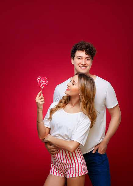 Portrait of a Man and Woman in the style of pin-up with candy in - Fotó, kép