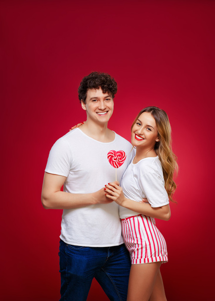 Portrait of a Man and Woman in the style of pin-up with candy in - Фото, зображення
