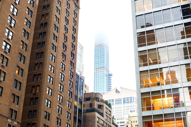 Skyscrapers rising up to sky on Manhattan - Fotografie, Obrázek