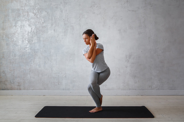 Young woman practicing advanced yoga - Photo, image