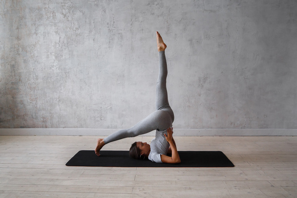 Young woman practicing advanced yoga - Фото, зображення