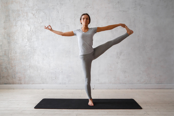 Woman practicing advanced yoga - Foto, imagen