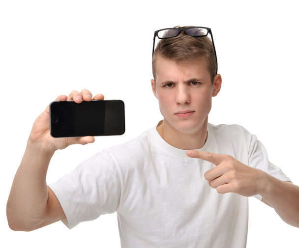 Happy young man show display of mobile cell phone with blank scr - 写真・画像
