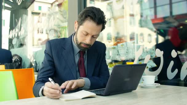 businessman working with laptop and notepad - Footage, Video