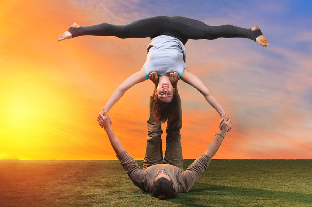 The two people doing yoga exercises - Fotó, kép